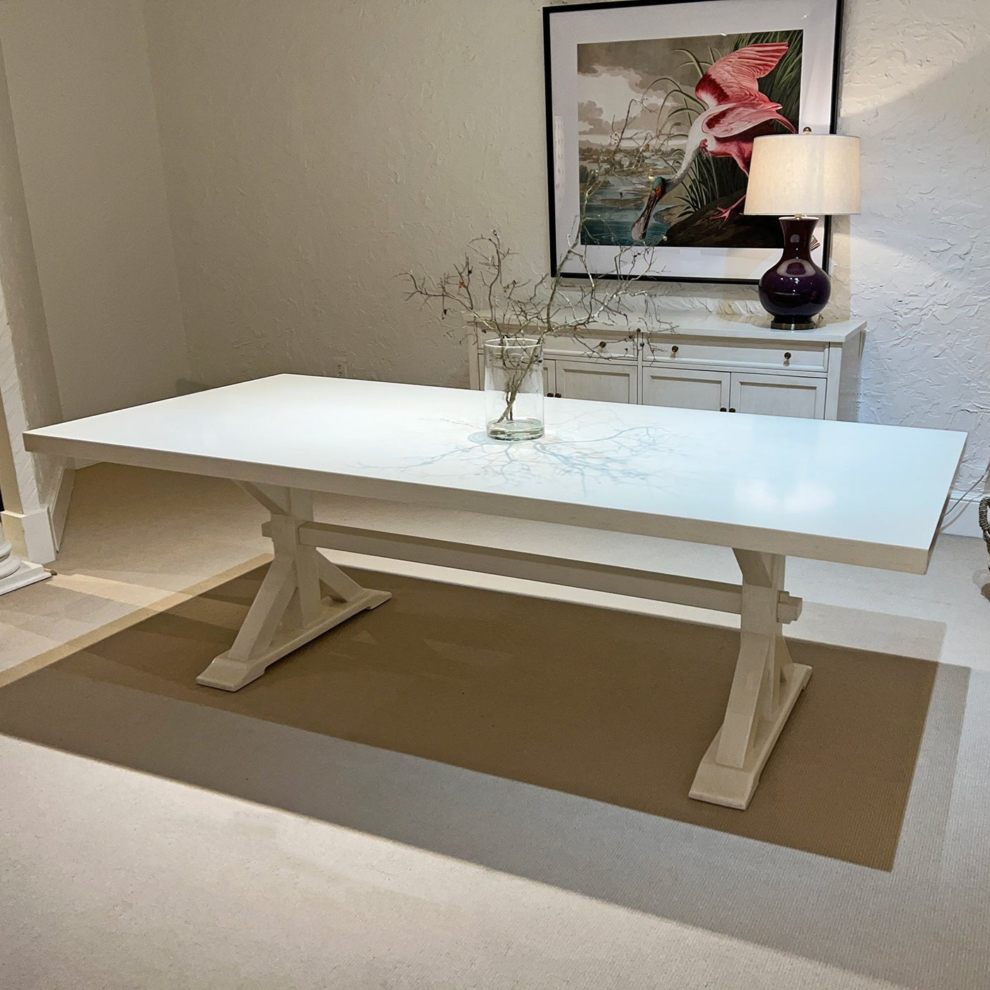 Dining table with decorative centerpiece, elegant room setting.
