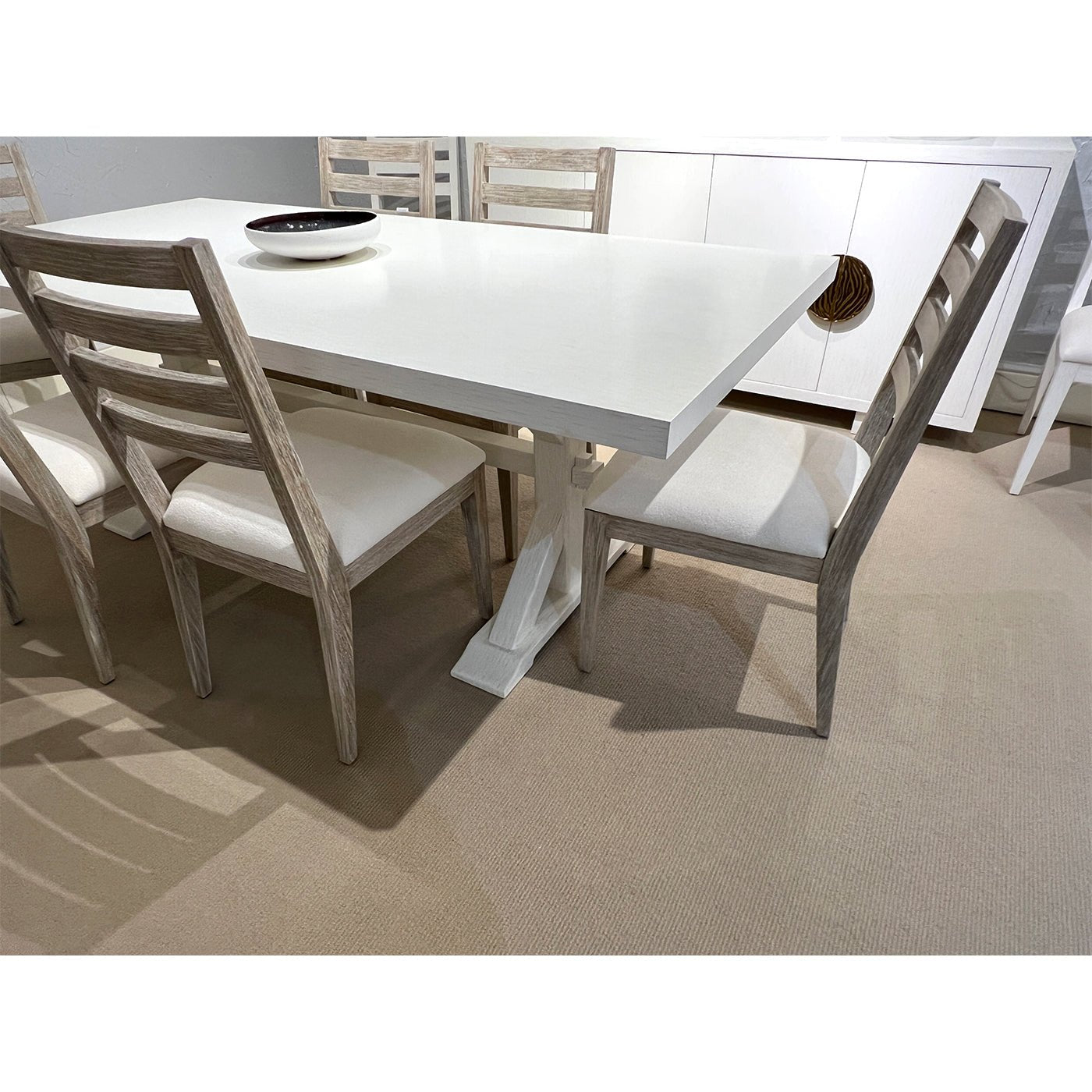 Close-up of dining table with chairs, top detail.