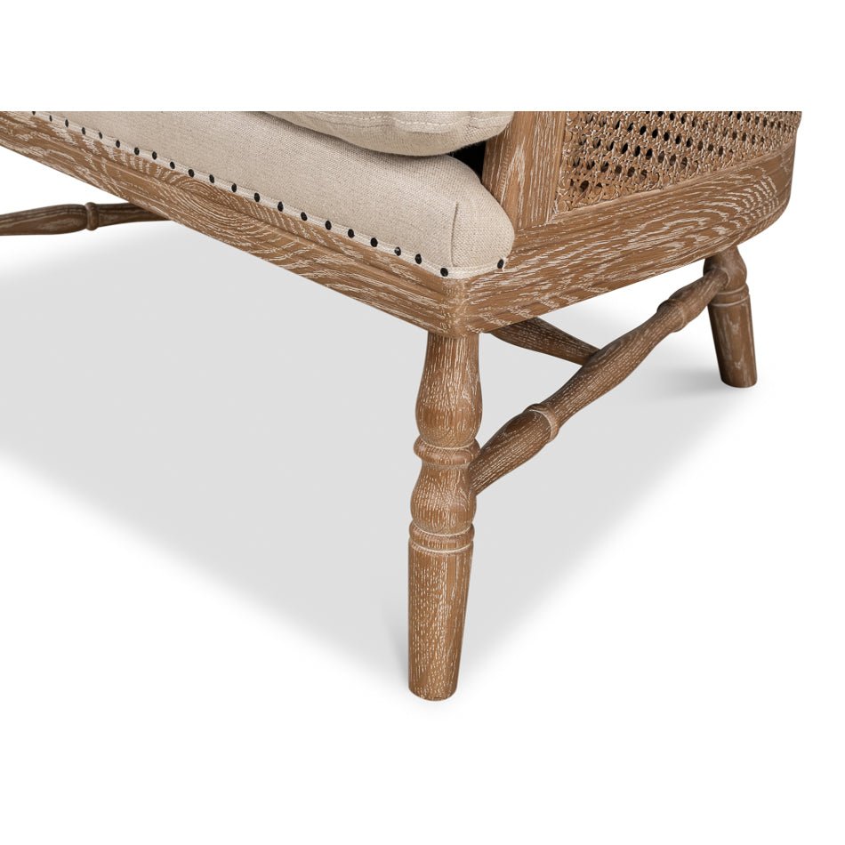 Close-up of armchair leg and cushion corner.