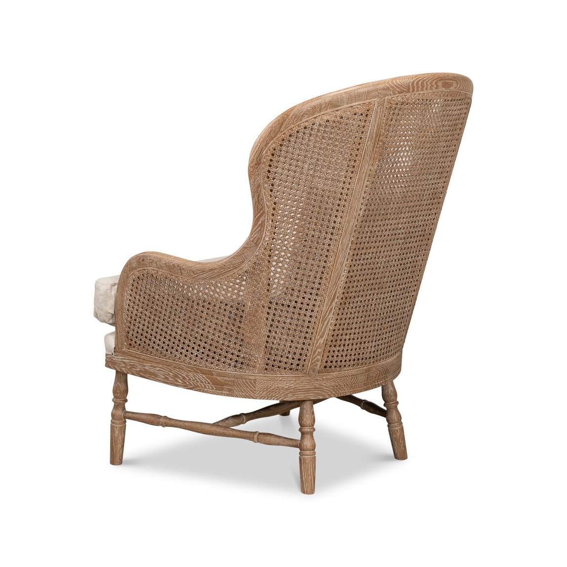 Angled rear view of French oak armchair.