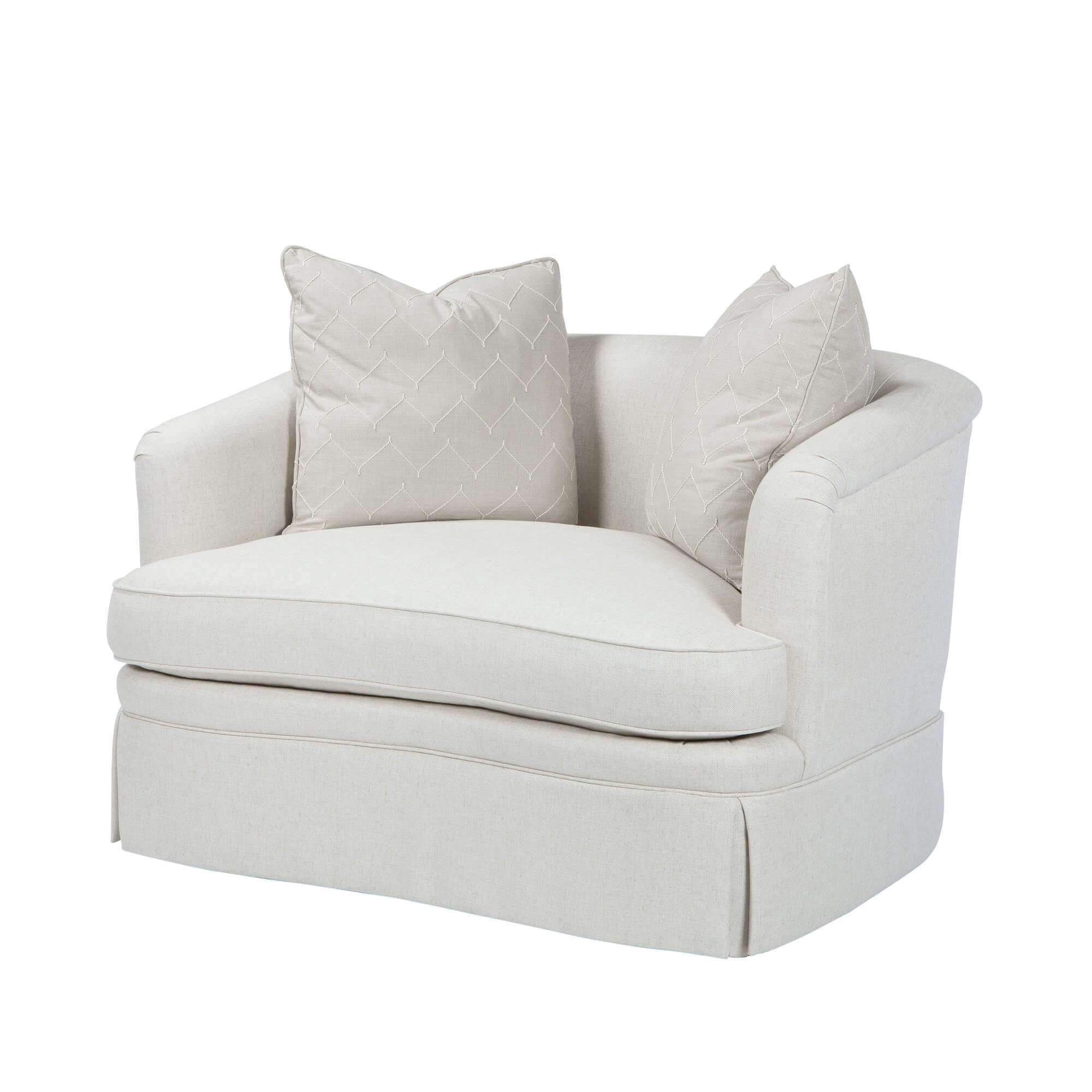 Beige art deco armchair, front view with pillows.