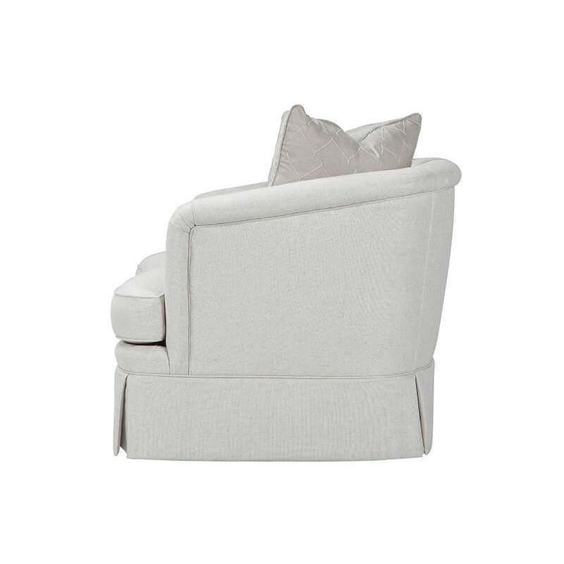 Beige art deco armchair, side profile with pillows.