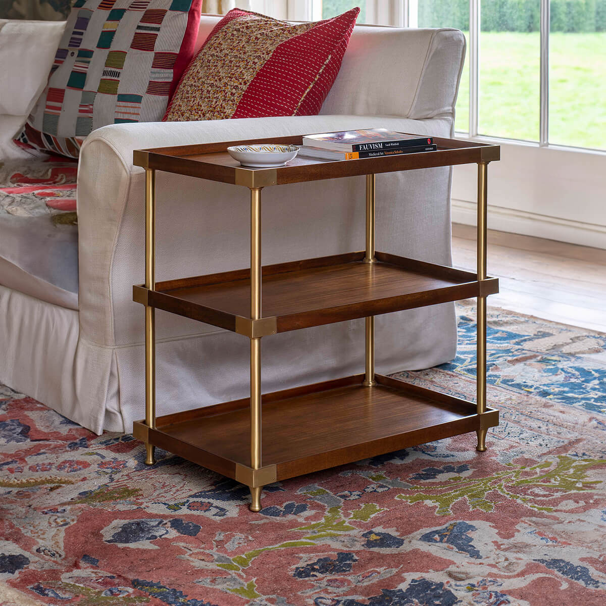 Wide modern etagere in living room, styled setting.