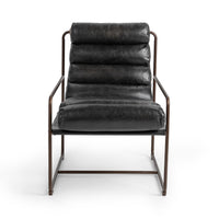 Front view of the Jet Black leather accent chair with broad padded channels