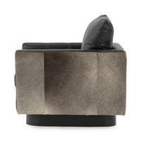 Side view of the Onyx Black swivel chair showing its hair-on-hide exterior