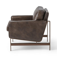 Side view of the Truffle Brown leather chair showing its sloped back and bronze-finished frame