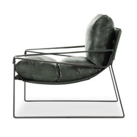 Side view of forest green leather sling chair, showing suspended seat and slim iron frame