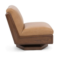 Side view of the tan leather swivel chair showing its angled walnut shell and low base
