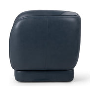 Angled rear view of the Mystic Blue leather swivel chair showing its rounded shell and piped edge