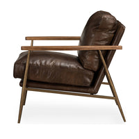 Side view of the Truffle Brown leather chair showing its angled back and splayed iron legs