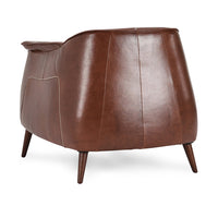 Rear three-quarter view of the Spiced Brown leather chair showing its rounded paneled back