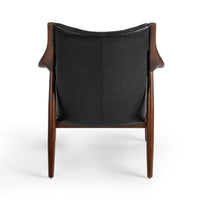 Rear view of the Jet Black leather chair showing its exposed ash frame