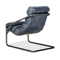 Rear three-quarter view of the Ocean Blue leather chair with exposed iron frame