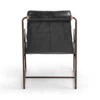 Rear view of the Jet Black leather chair showing its sling back and iron supports