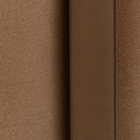 Tan leather and iron frame close-up showing their contrasting textures