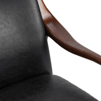 Jet Black leather chair detail showing the curved ash arm beside the seat and back