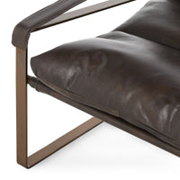 Truffle Brown leather sling chair detail showing the seat cushion and padded armrest