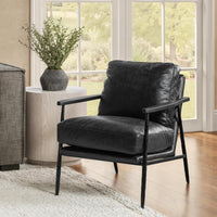 Jet Black leather accent chair with open arms styled beside a window and side table
