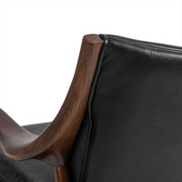 Rear backrest detail of the Jet Black leather chair with sculpted ash support