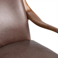 Barrel Brown leather chair detail showing the seat, back and curved ash arm