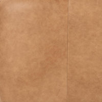 Tan leather upholstery close-up showing tonal variation and a vertical seam