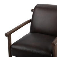Dark Roast leather chair detail showing the seat, back and rounded wood arms