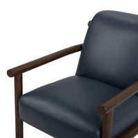 Mystic Blue leather chair detail showing the seat, back and rounded wood arms