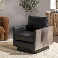 Onyx Black leather swivel chair with hair-on-hide sides styled beside a wood cabinet