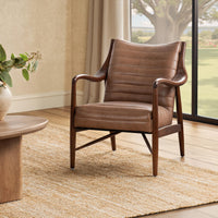 Adobe tan leather accent chair with curved wood arms, styled beside a window
