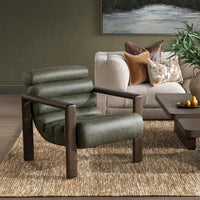Soft Sage leather channel-seat chair styled beside a sofa and wood coffee table