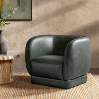 Hunter Green leather barrel-back swivel chair styled beside a wood side table