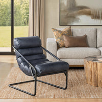 Ocean Blue leather channel-back chair styled on a rug beside a sofa