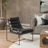 Jet Black leather channel-seat chair styled beside a sofa and coffee table