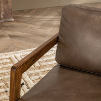 Truffle Brown leather chair arm and cushion detail in a living-room setting