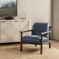 Mystic Blue leather accent chair styled beside a geometric-front cabinet