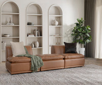 Toffee brown leather armless chairs arranged side by side in a styled living room