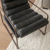 Overhead detail of the Jet Black leather chair showing its channelled seat and open arms