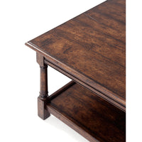 Close-up of cocktail table corner and shelf.