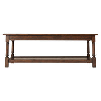 Side view of dark wood cocktail table.