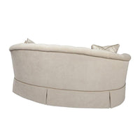 Rear angle, elegant curved back sofa design.