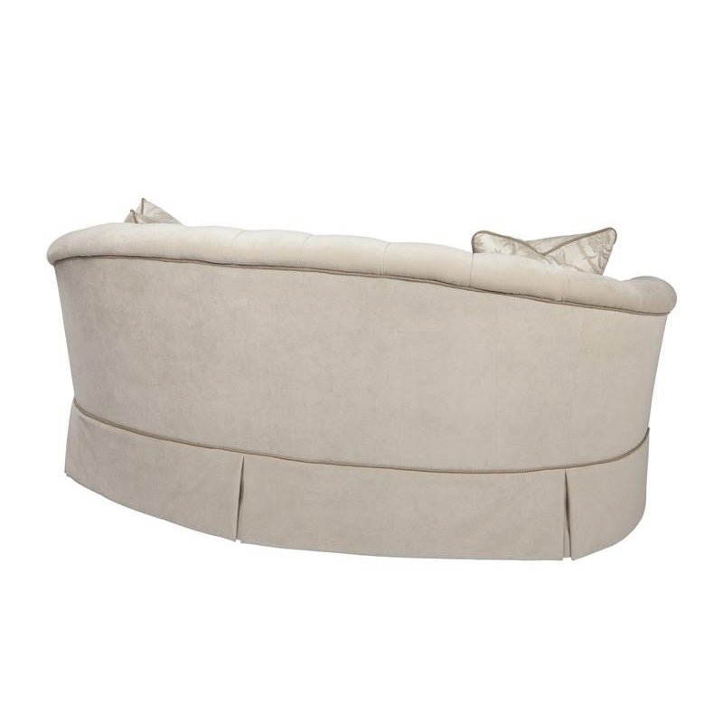 Rear angle, elegant curved back sofa design.