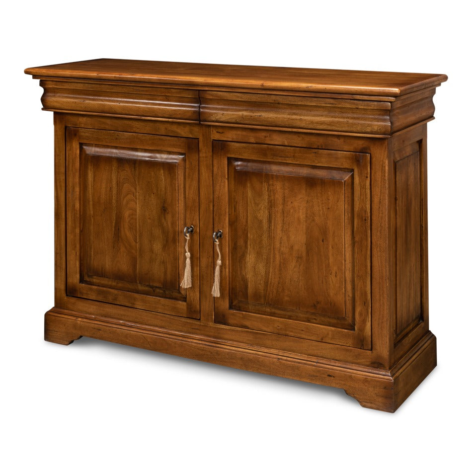 Traditional walnut sideboard cabinet in fruitwood finish with two recessed paneled doors, tassel-style pulls, and a block plinth base