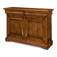 Traditional walnut sideboard cabinet in fruitwood finish with two recessed paneled doors, tassel-style pulls, and a block plinth base