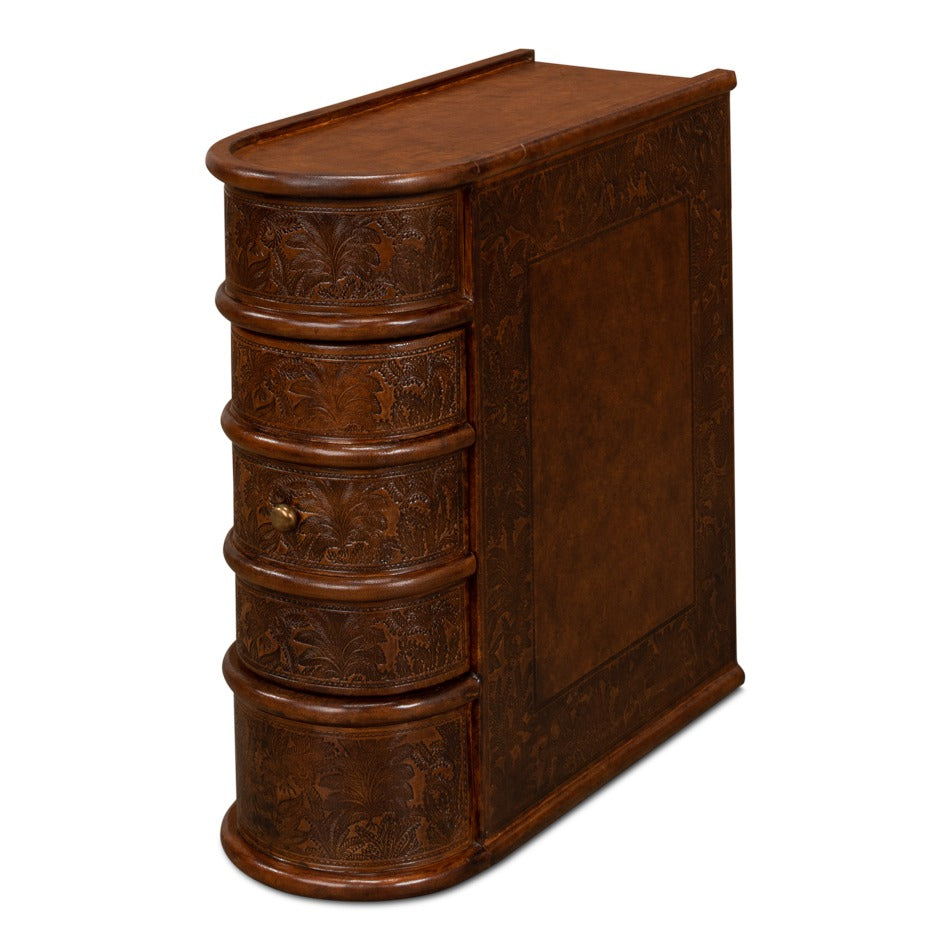 Narrow side table styled as a stack of leather-bound books in dark brown embossed leather with brass knob
