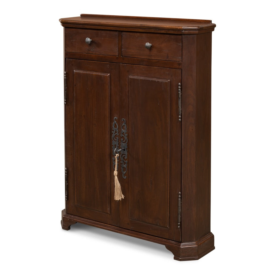 Tall narrow traditional hall cabinet in solid walnut with paneled doors and cast brass hardware