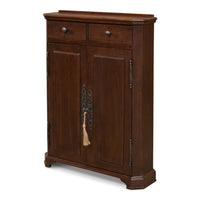 Tall narrow traditional hall cabinet in solid walnut with paneled doors and cast brass hardware