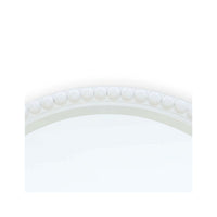 Detailed view of top section of beaded mirror.