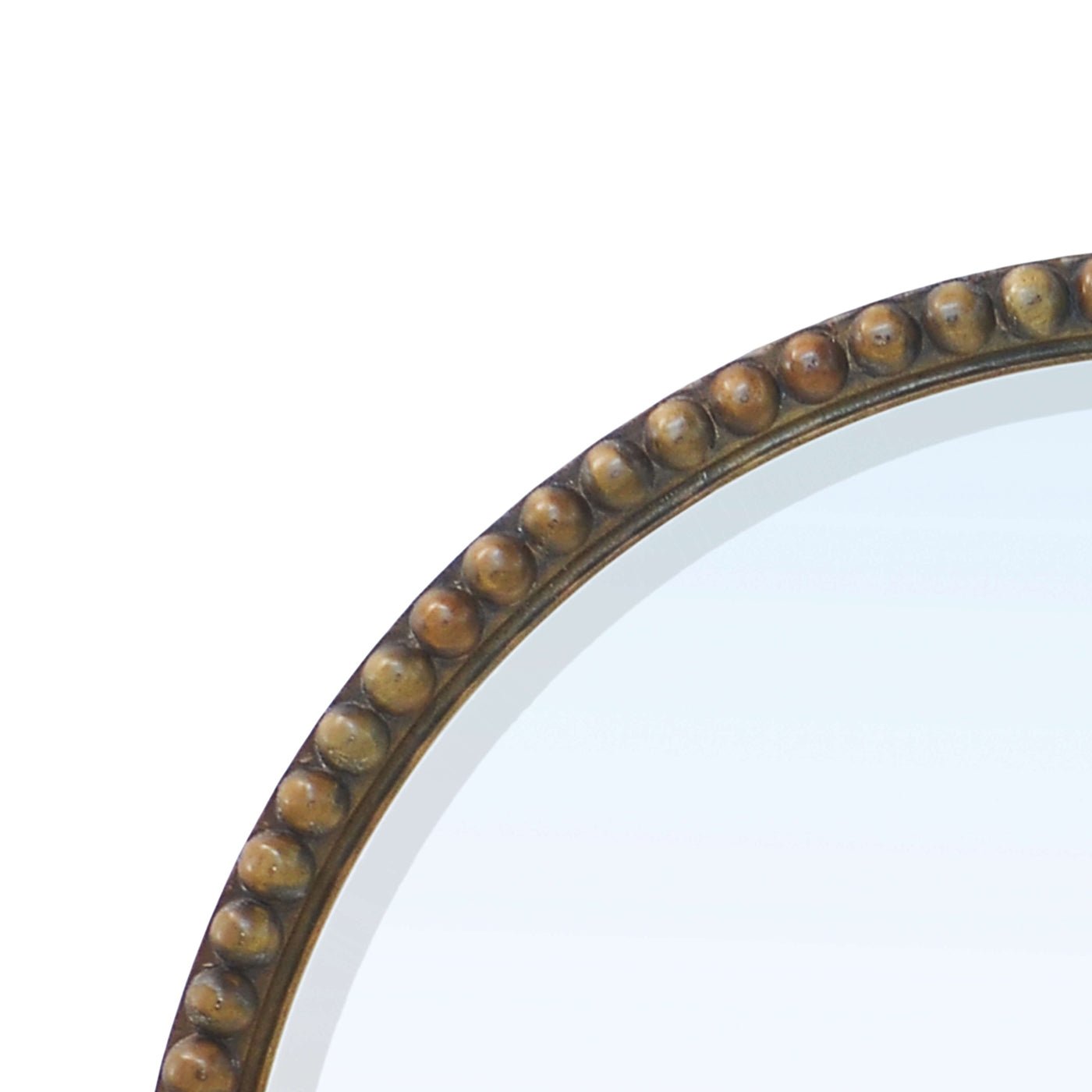 Close-up of beaded edge on round mirror.