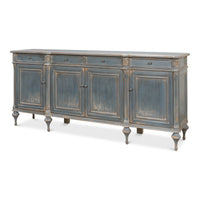 Long blue-grey painted French Provincial pine sideboard with four drawers, four paneled doors, carved rosettes, and turned baluster legs