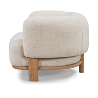 Rear three-quarter view of the Natural chair's padded back and ash supports